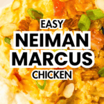 Close-up of creamy Slow Cooker Neiman Marcus Chicken topped with green onions and sliced almonds on a white plate.