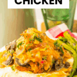 A plate of savory Outback Alice Springs Chicken, a classic chicken recipe, served with mashed potatoes and asparagus on a checkered cloth.