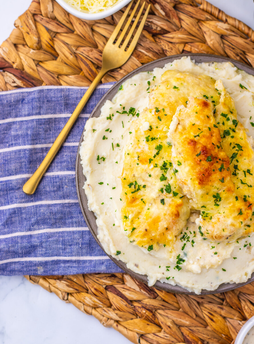 Creamy Chicken Caesar Bake with golden chicken and mashed potatoes garnished with parsley