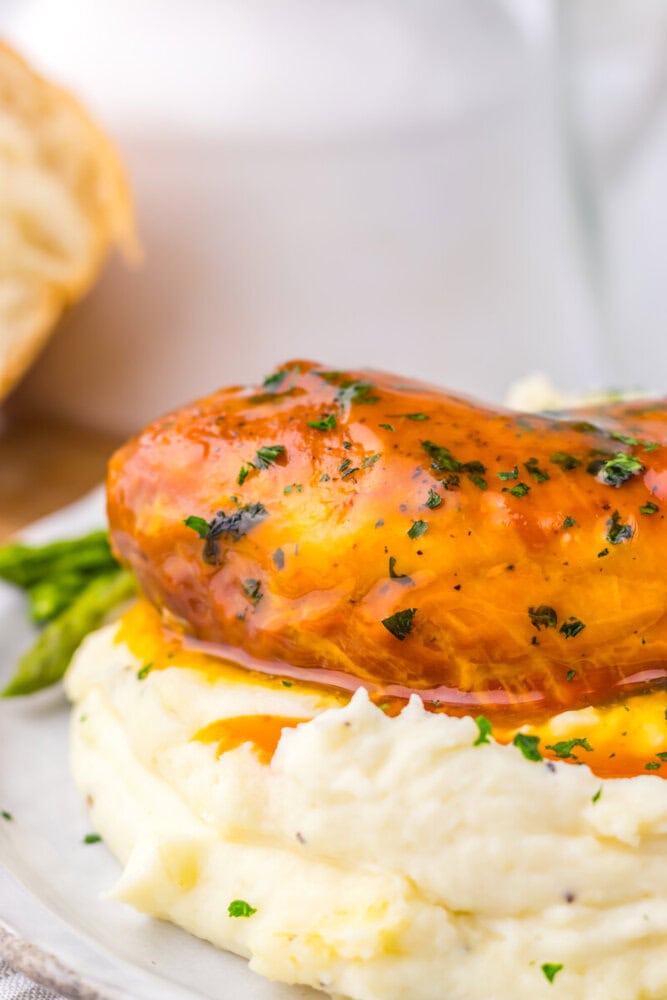 Slow cooker apricot brown sugar chicken with mashed potatoes and asparagus