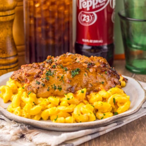 Slow Cooker Dr Pepper BBQ Brisket with creamed corn garnished with parsley, plated and ready to serve