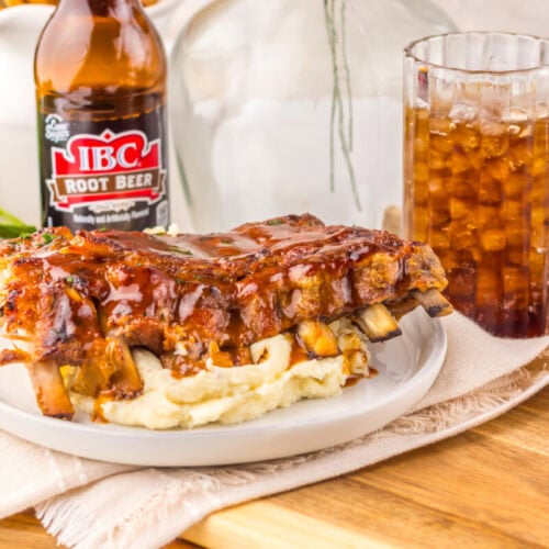 Slow cooker root beer BBQ ribs with mashed potatoes served with IBC root beer