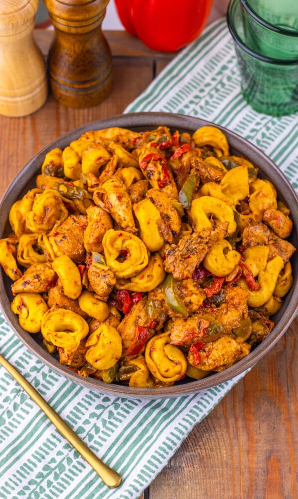 Southwest Ranch Chicken Tortellini with golden pasta and peppers in a gray serving bowl