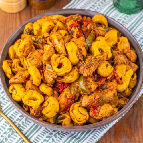 Southwest Ranch Chicken Tortellini plated in bowl with seasoned chicken, pasta, and peppers