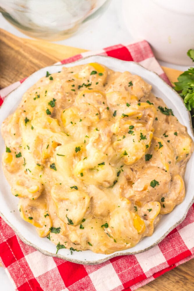 Slow cooker French onion chicken tortellini with creamy sauce and fresh parsley garnish