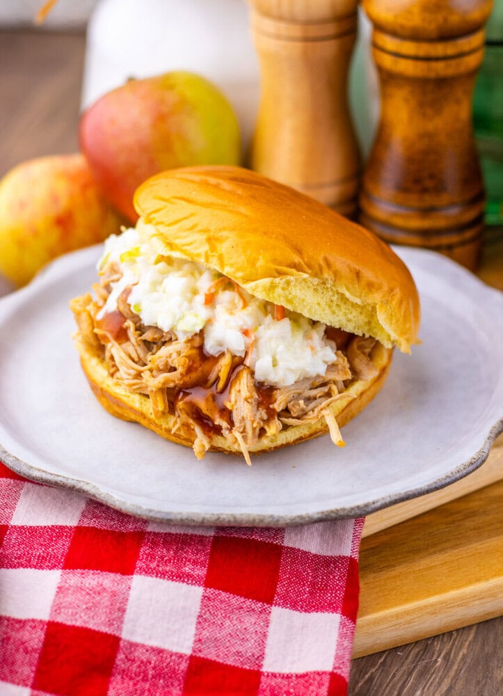 Apple Cider BBQ Pulled Chicken sandwich with coleslaw on brioche bun