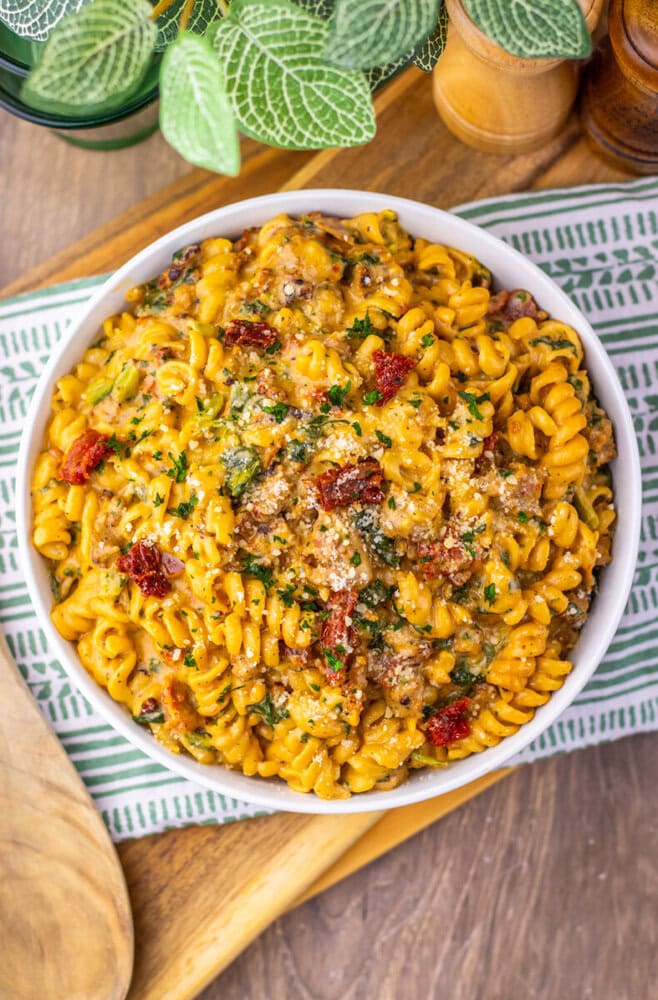 One Pot Zuppa Toscana Pasta with ground meat, herbs, and parmesan in white bowl