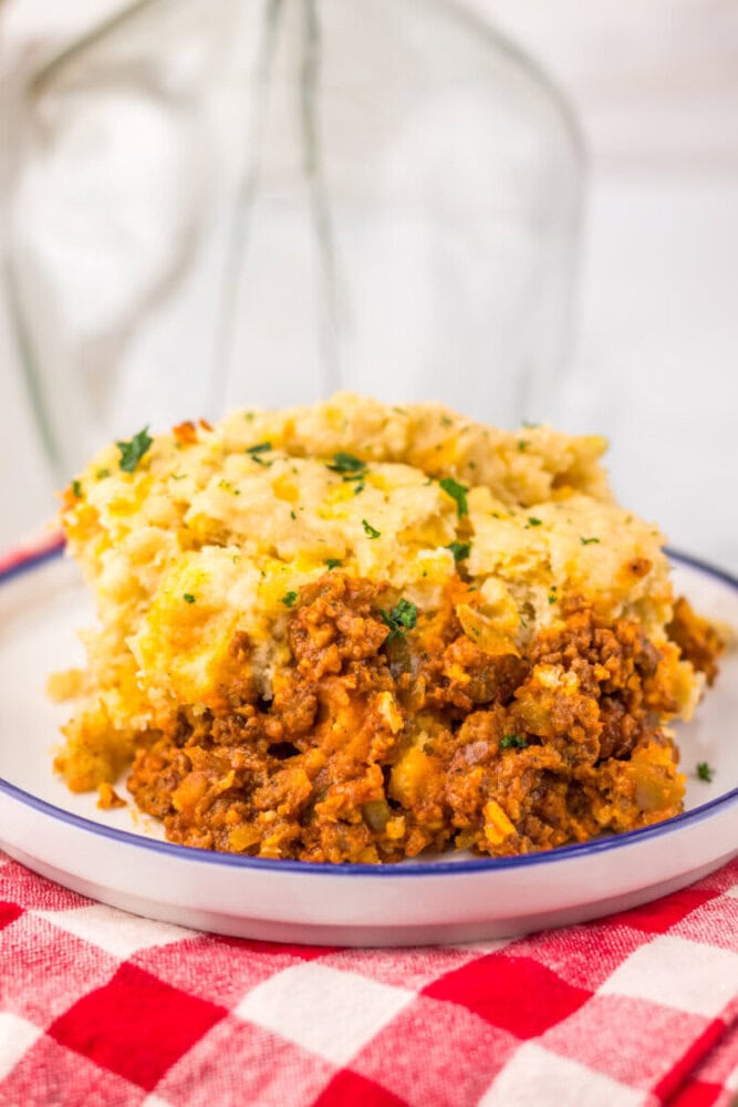 Slow Cooker Cheddar Bay Sloppy Joe Bake with creamy mashed potato topping on a white plate