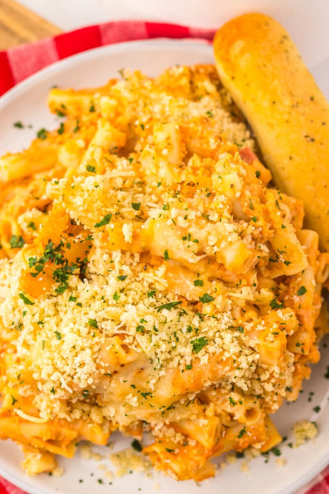 Slow Cooker Five Cheese Ziti Al Forno with breadcrumb topping and fresh parsley garnish, plated and ready to serve