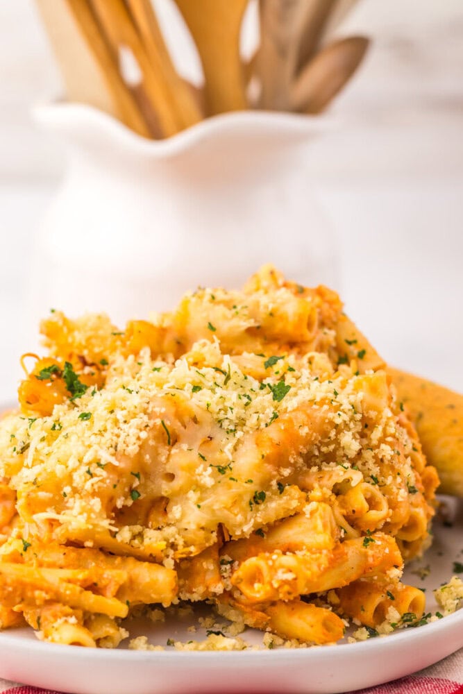 Slow cooker five cheese ziti al forno with crispy breadcrumb topping and parsley garnish plated and ready to serve