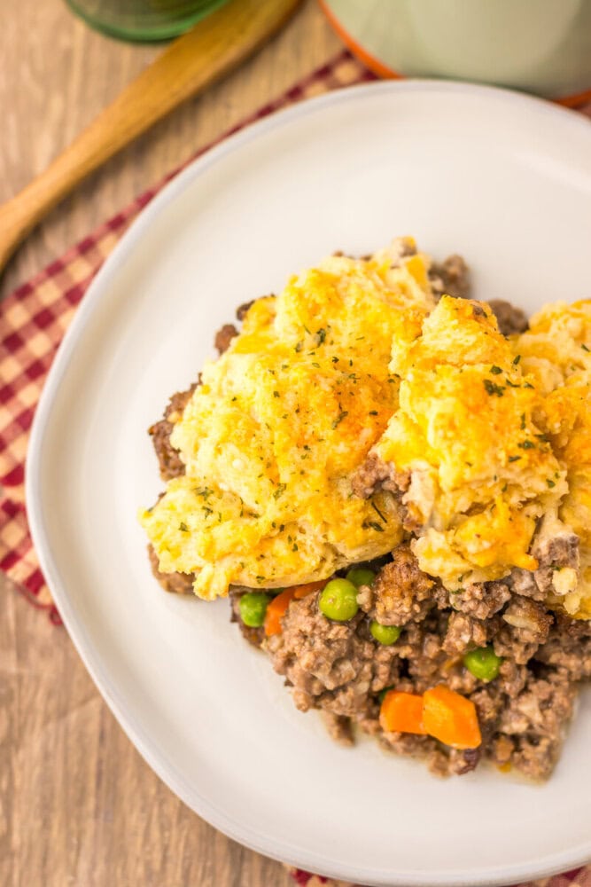 Cheddar Bay Beef Cobbler with golden mashed potato topping and ground beef vegetable filling on white plate