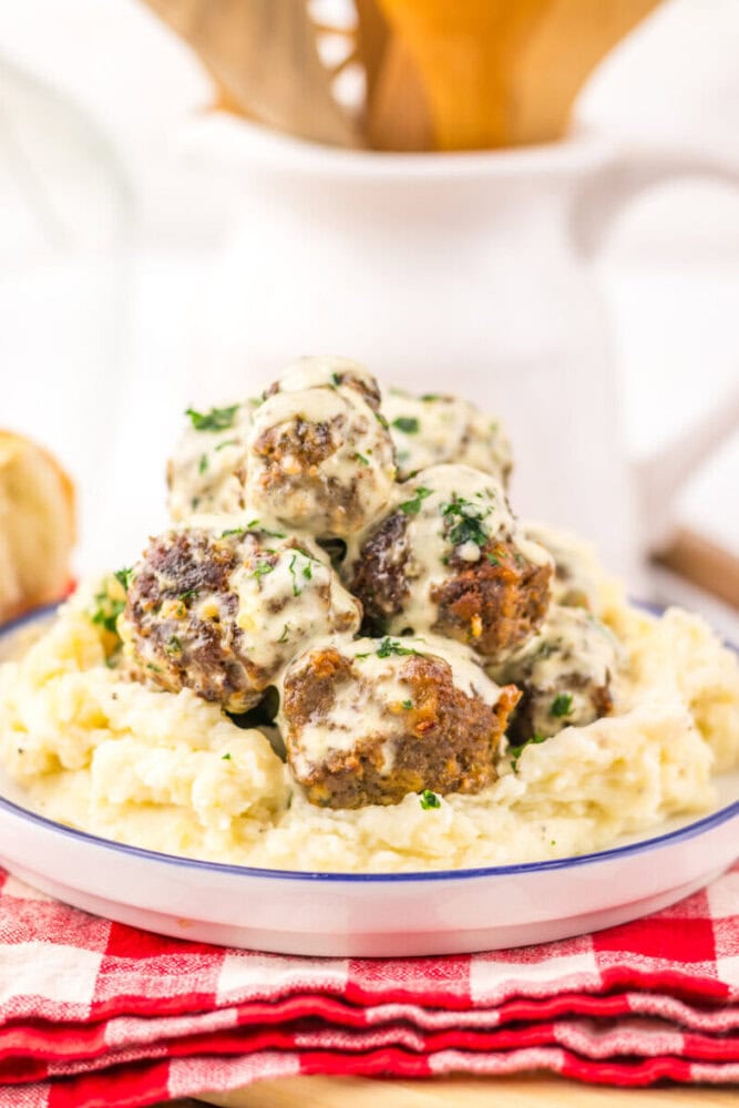 Cowboy Butter Meatballs with creamy sauce and parsley served over mashed potatoes