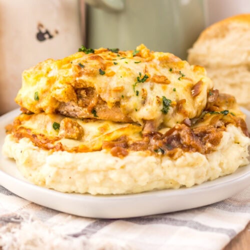 French Onion Chicken Bake with melted cheese and caramelized onions on mashed potatoes