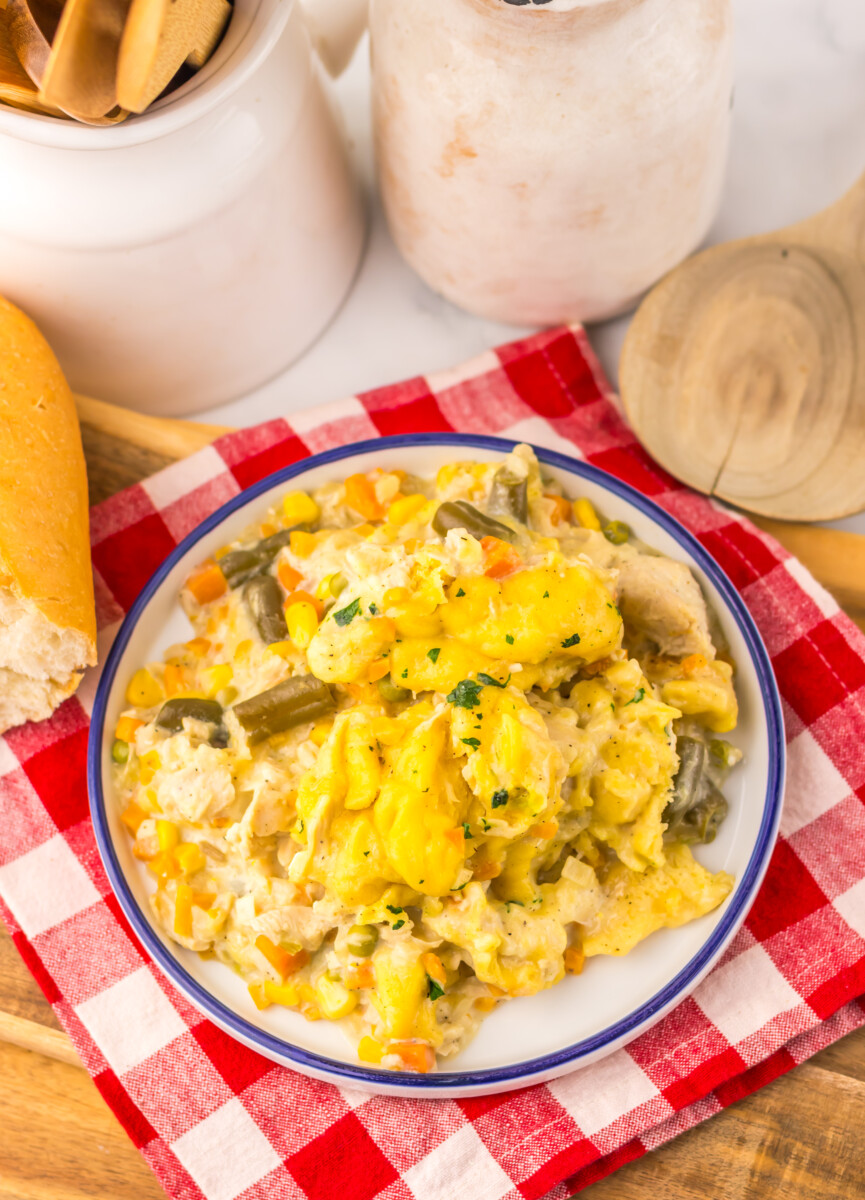 Slow cooker chicken and dumplings pot pie plated and ready to serve with vegetables and dumplings