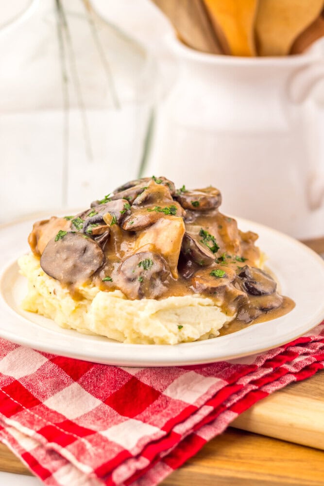 Slow Cooker Salisbury Chicken with mushroom gravy served over mashed potatoes