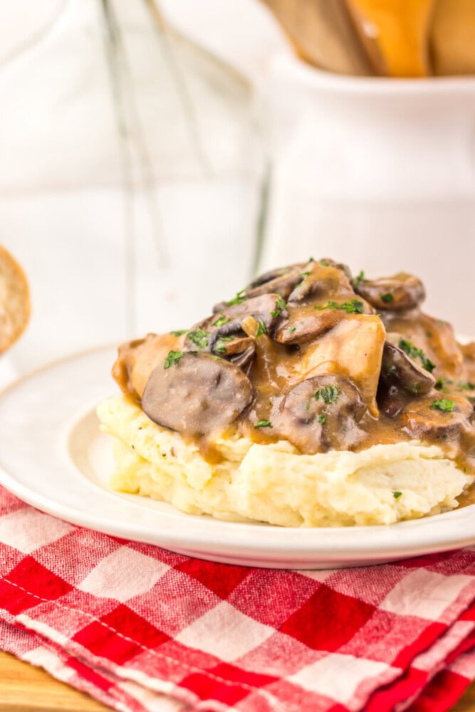 Slow Cooker Salisbury Chicken with mushroom gravy served over mashed potatoes