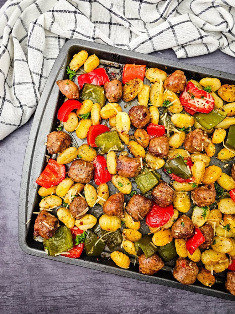 Sheet Pan Sausage and Gnocchi with roasted peppers and herbs, fully cooked and ready to serve