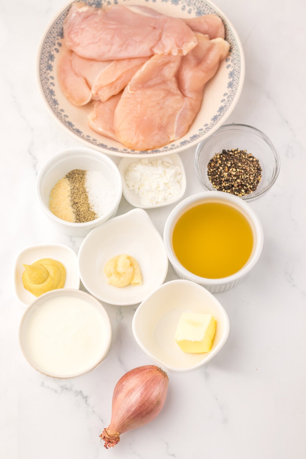 Slow cooker chicken au poivre ingredients including raw chicken breasts, cream, butter, garlic, shallot, mustard, olive oil, and peppercorns